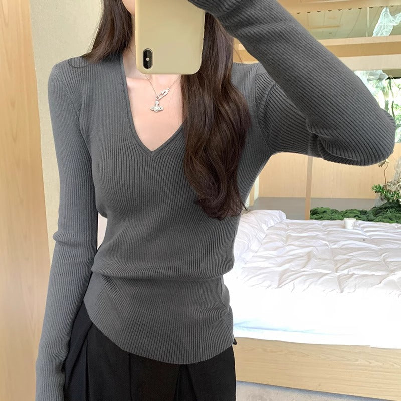 Slimming Knit Top With A Distinctive V-neck And Long Sleeves